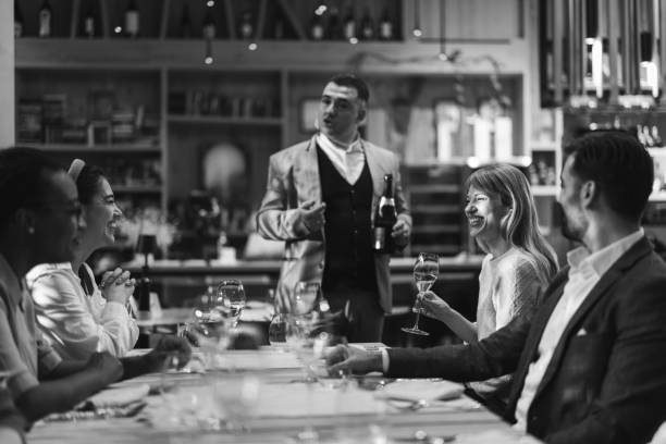 istock Multiracial group of people sitting in luxury restaurant 2201654384