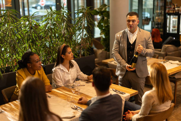 istock Multiracial group of people sitting in luxury restaurant 2201655016