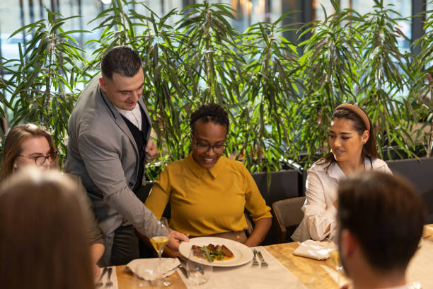 istock Group of people dinning in luxury restaurant 2201655515