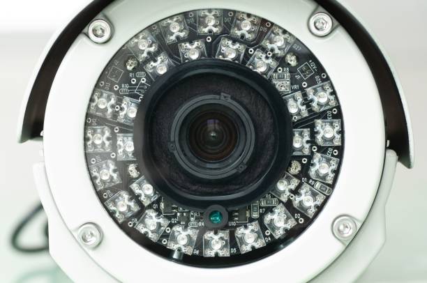 istock Close-up of a security camera lens with LED lights. 2201655587