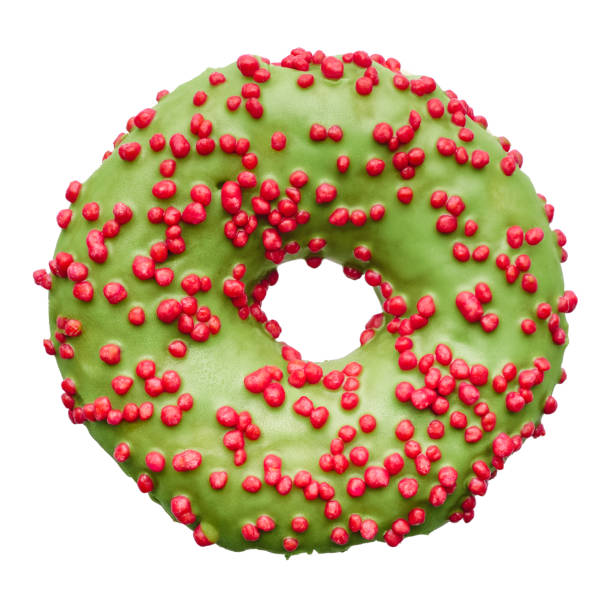 istock Single donut decorated with green icing and red sprinkles 2201658903