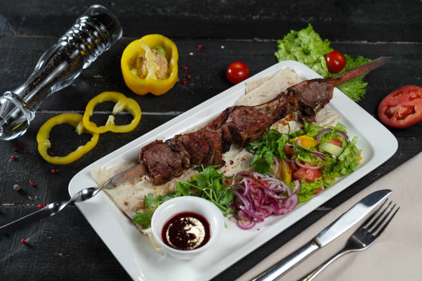 istock menu for restaurant shashlik kebab on skewer on grill with smoke vegetables on black background 2201659025