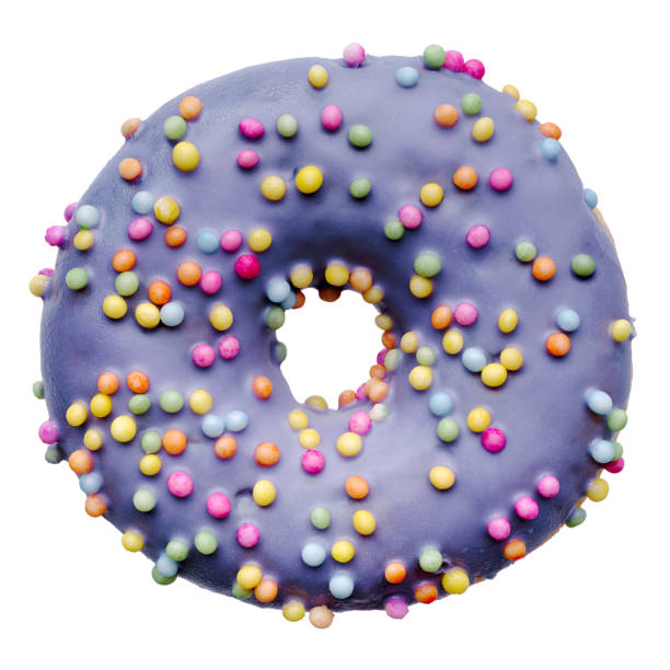 istock Single donut decorated with purple icing and colorful sprinkles 2201659159
