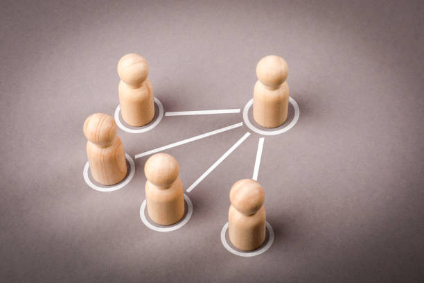 istock Human figures on a gray background. A hierarchical system within a company or organization Leadership 2201663715