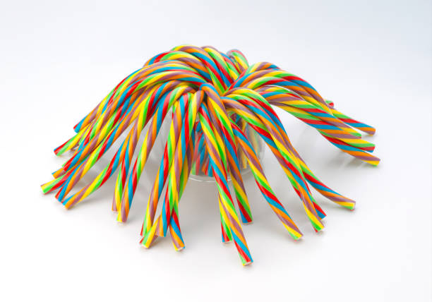 istock Colorful Twisted Licorice Candy Sticks in Glass Jar 2201664751