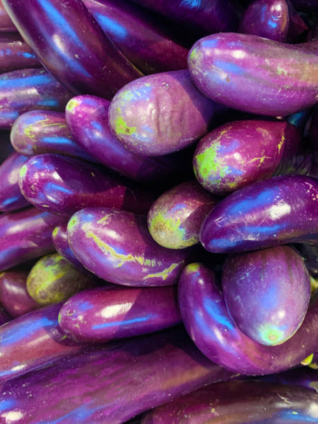 istock eggplants at the market close up shot 2201667067