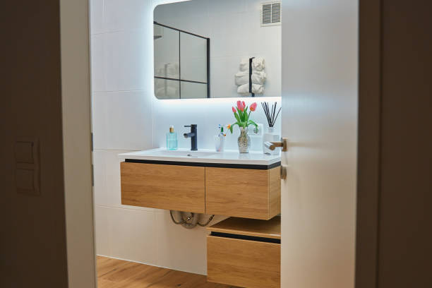 istock Modern Bathroom Interior with LED Mirror And Wooden Sink Cabinet 2201667806