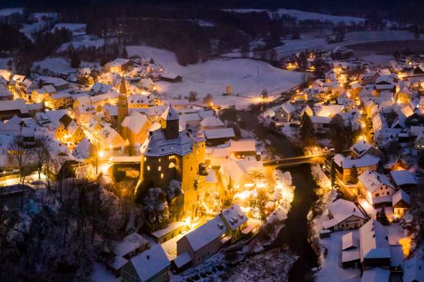 istock Snowy Village with Castle at Dusk 2201672784