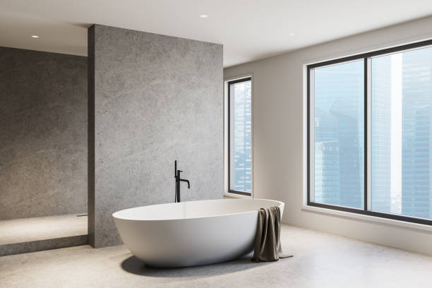 istock Minimalist bathroom interior with modern freestanding tub in bright space. 3D Rendering 2201673913