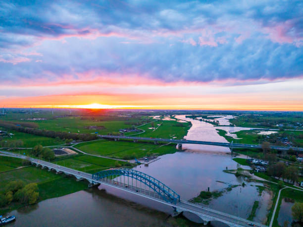 istock Amazing colorful sunset over the river IJssel 2201675336