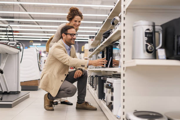 istock Couple selecting the perfect microwave for their home 2201677647