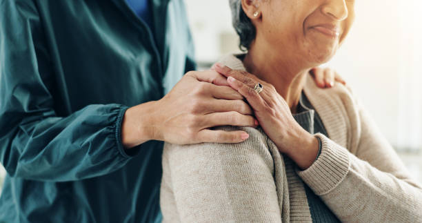 istock Healthcare, empathy and holding hands for support, smile and physiotherapist with elderly patient. Clinic, medical professional and caregiver for senior care, people or appointment for rehabilitation 2201680278