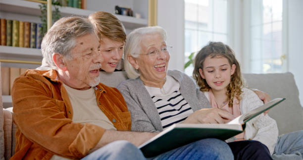istock Diverse Family Joyfully Sharing Memories on Cozy Couch 2201682452