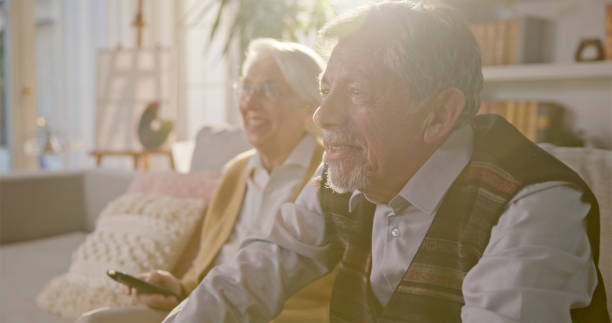 istock Joyful Senior Caucasian Couple Relaxing at Home 2201682461