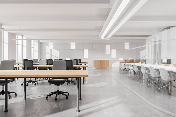 istock Modern open-space office interior with large windows, cityscape view, and rows of desks and chairs. 3D Rendering 2201682926
