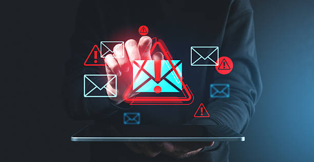 istock Digital spam warnings over tablet screen in dark background. 2201684395