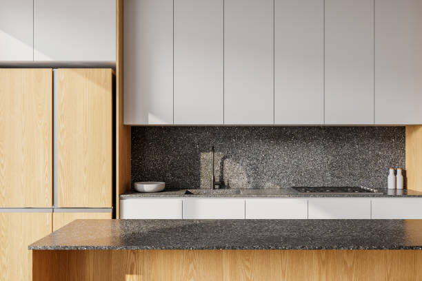 istock Modern kitchen interior with gray speckled countertop and wooden cabinets. 3D Rendering 2201684412