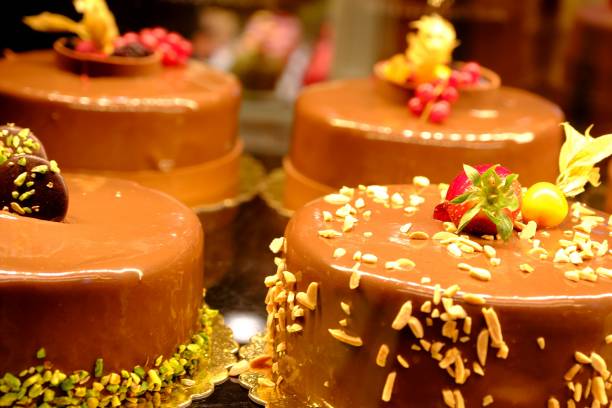 istock Chocolate birthday cakes in a pastry shop window 2201688669