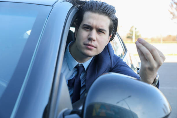 istock Young Successful Businessman Arguing with the Driver in Front While Driving 2201692108