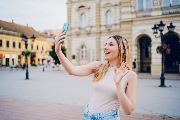 istock A young woman make selfie or has video call on travel 2201692455
