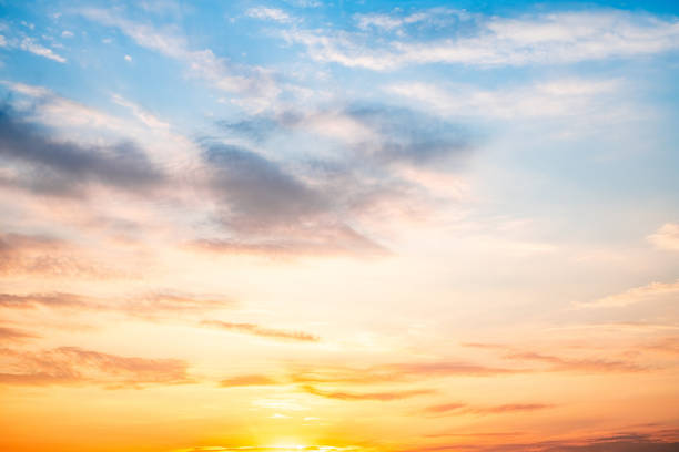 istock Sky,sunset, beautiful , luxury soft gradient orange gold clouds and sunlight on the blue sky perfect for the background, Sunrise on morning or everning in winter warm time ,Twilight summer,silhouette 2201695292
