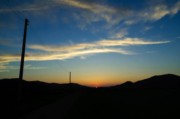 The sunset from the countryside farm road.