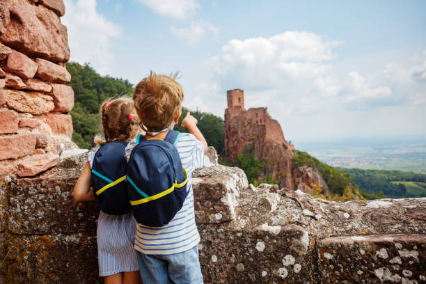 Kids spot distant castle Girsberg ready for exciting journey