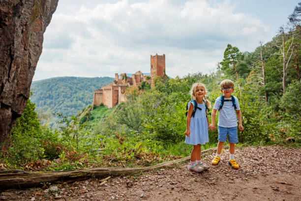 istock Exploring nature, kids smile near ancient castle Saint-Ulrich 2201697235