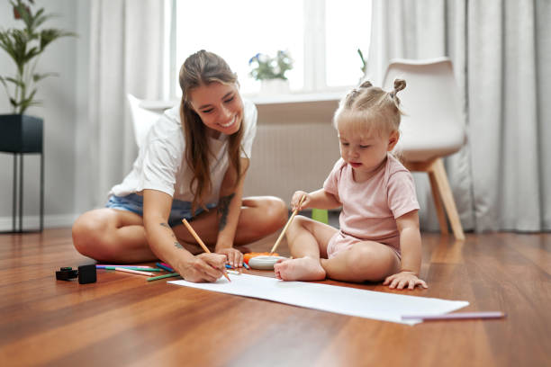 istock Bonding Through Creativity A Mother and Her Child Joyfully Engaging Together in Fun Art Activities 2201697823
