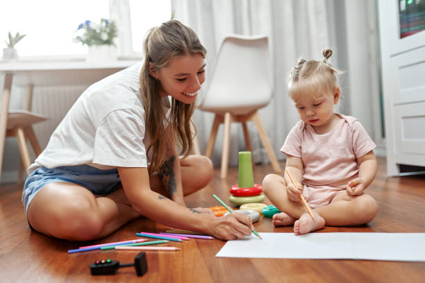 istock Bonding Through Creativity A Mother and Her Child Joyfully Engaging Together in Fun Art Activities 2201697829