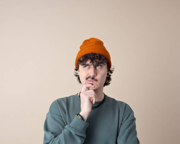 istock Headshot of confused young man 2201698521