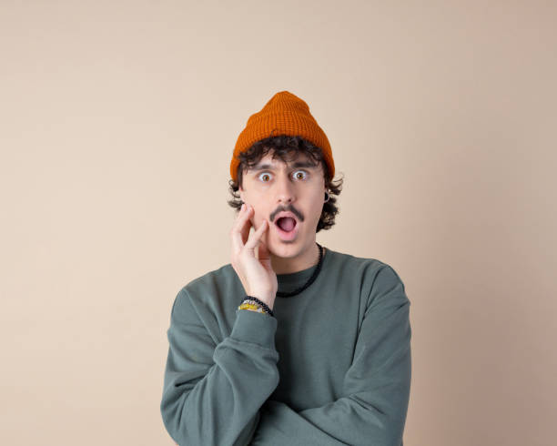 istock Headshot of shocked young man 2201698810