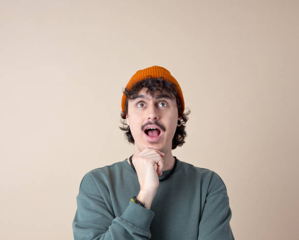 istock Headshot of surprised young man 2201698921