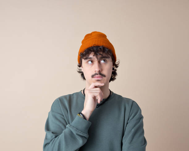 istock Headshot of thoughtful young man 2201699034