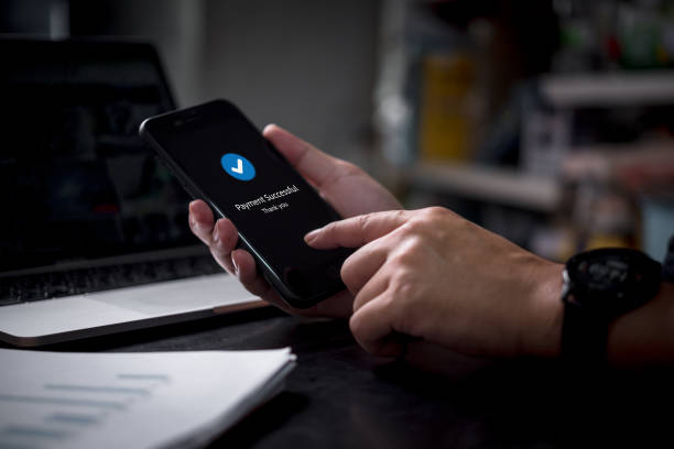 istock Online transaction and mobile banking with a smart device. Secure digital payment, business communication, and shopping success through internet connection on a modern smartphone. 2201699476