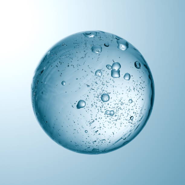 istock spherical object made of clear material is submerged in water, showcasing numerous bubbles rising within. Soft lighting enhances its translucent appearance, creating an ethereal effect. 3d render 2201700672