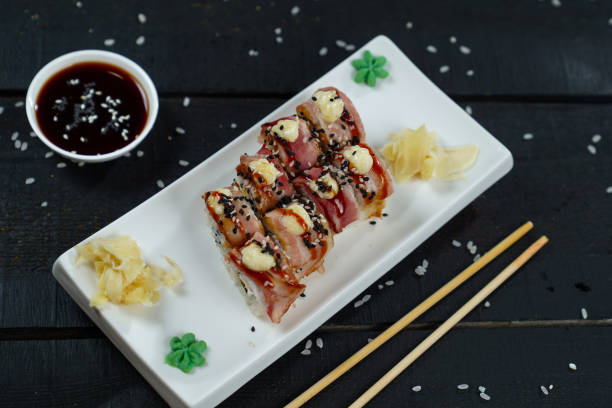 istock menu for a restaurant sushi rolls bacon hot ginger soy sauce wasabi rice serving serving on a black background 2201702865