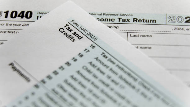 istock Tax return documents highlighting important financial information for 2024 2201703553