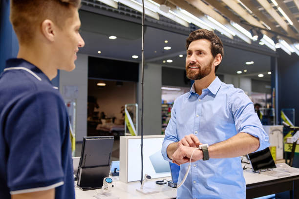 istock Engaging Customer Service Interaction at a Technology Retail Store for Electronic Gadgets 2201703940