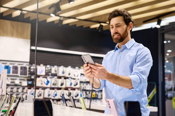 istock The customer is engaged in an exciting smartphone shopping experience, exploring products 2201703943