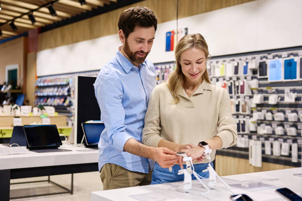 istock A couple enthusiastically exploring various kinds of electronics at a retail store 2201703982