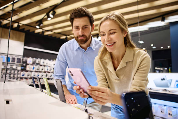 istock A Couple Enthusiastically Exploring the Latest Models of Smartphones in a Local Electronics Store 2201703992