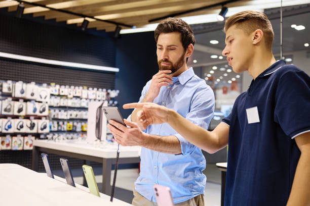 istock A friendly interaction occurs between a salesperson and a customer in a smartphone store 2201703995