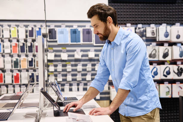 istock A Tech Store Employee is Providing Assistance to Customers in Choosing the Right Devices 2201704008