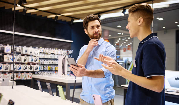 istock A friendly interaction occurs between a salesperson and a customer in a smartphone store 2201704025