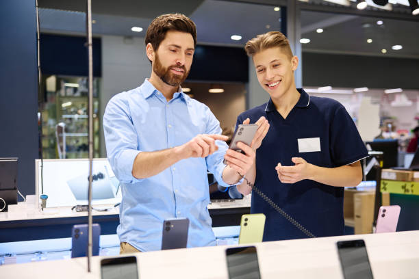istock A friendly interaction occurs between a salesperson and a customer in a smartphone store 2201704026