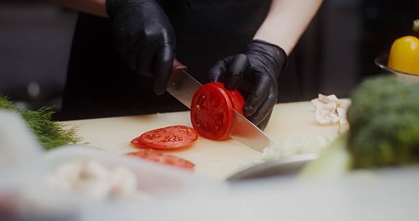 A woman in an industrial kitchen