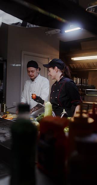 istock A man and a woman cook in the kitchen 2201705631