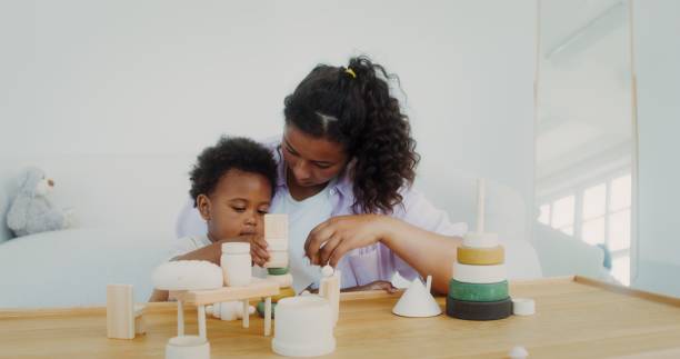 istock Mom and daughter play with toys 2201714579
