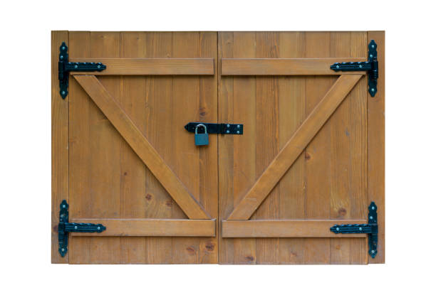 Small double wooden doors with black metal hinges and a padlock, resembling saloon doors from the Wild West or window shutters for added protection